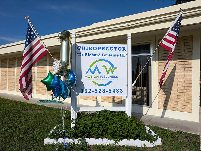 Office building sign of Motion Wellness Family Chiropractic Center