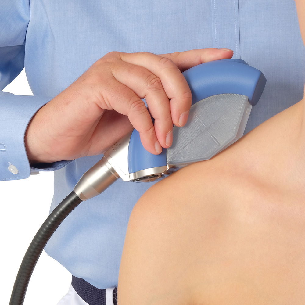 Patient getting shockwave therapy treatment on their shoulder